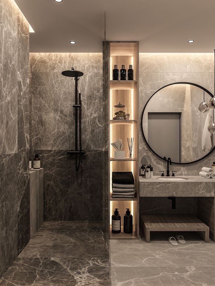 a bathroom with marble walls and flooring is lit by recessed lighting in the corner