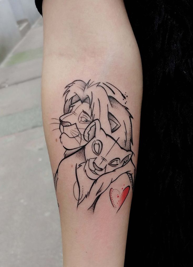 a woman's arm with a lion tattoo on the left side of her body