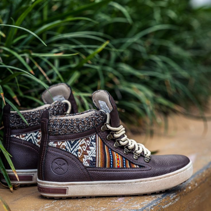 The Inkkas Camping Boot is one of the most unique and comfortable boots -- and this is our first ever in 100% vegan leather. Featuring our classic authentic Peruvian textile, complimented by a beautiful dark brown, these handcrafted and stylish boots will become a welcome companion wherever you travel. 100% vegan leather Soft mesh lining Woven sweater trim around upper, providing added warmth NEW cushion fit technology removable insole Brass eyelets Distressed outsole finish Peruvian Textiles, Leg Tattoos Women, Woven Sweater, Stylish Boots, Comfortable Boots, Sweater Accessories, Belt Bag, Kids Accessories, Vegan Leather