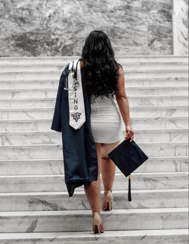 a woman is walking up some steps