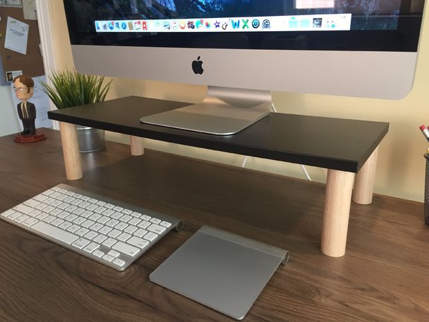 an apple computer sitting on top of a wooden desk next to a keyboard and mouse