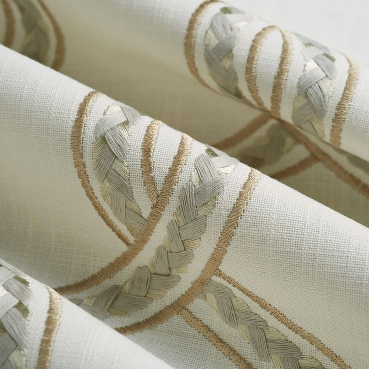 closeup of white and gold patterned fabric