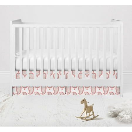 a baby crib with a rocking horse next to it on a white carpeted floor