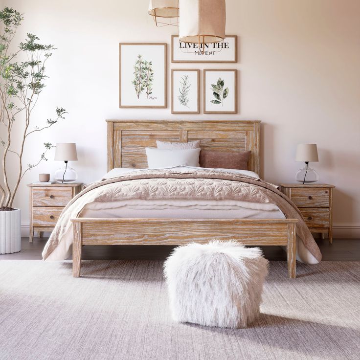 a bed room with a neatly made bed and some pictures on the wall above it