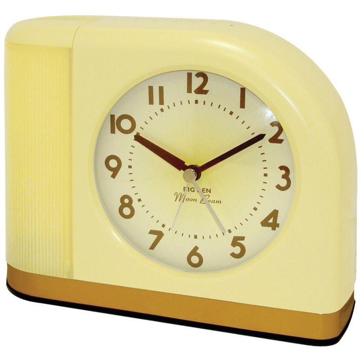 a small pink clock with numbers on the front and sides is shown in this image