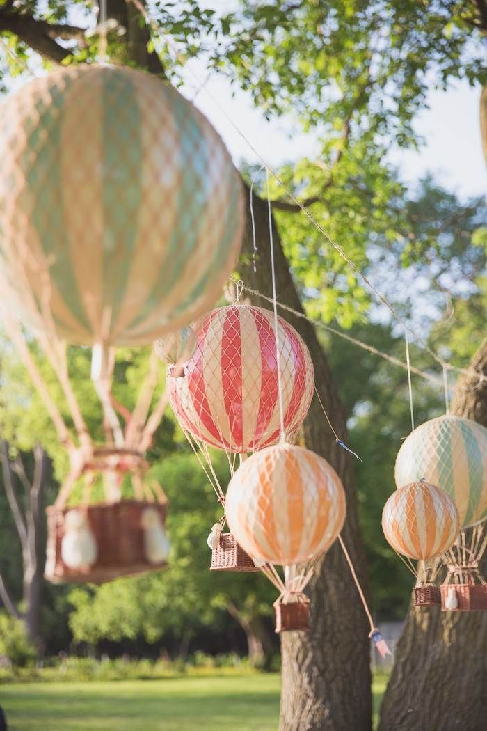 several hot air balloons floating in the sky