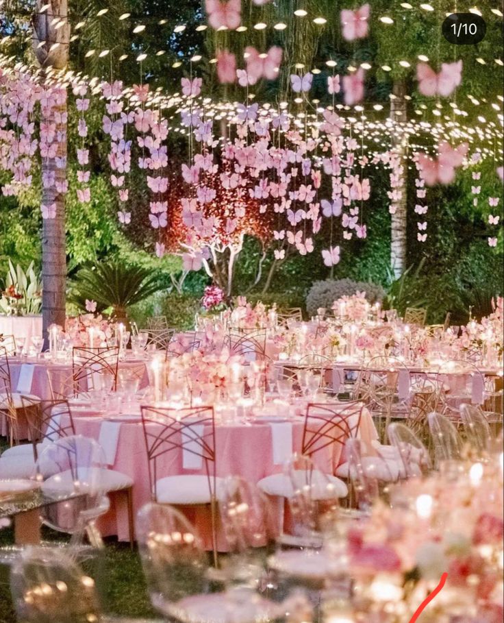 the tables are set with pink and white linens