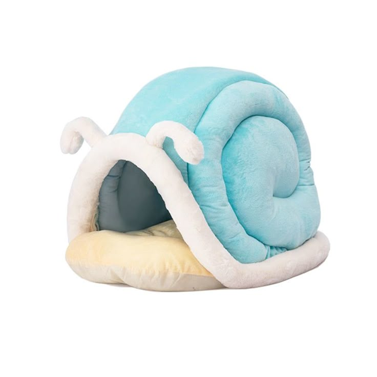 a blue and white snail shaped pet bed with a yellow pillow on the bottom side