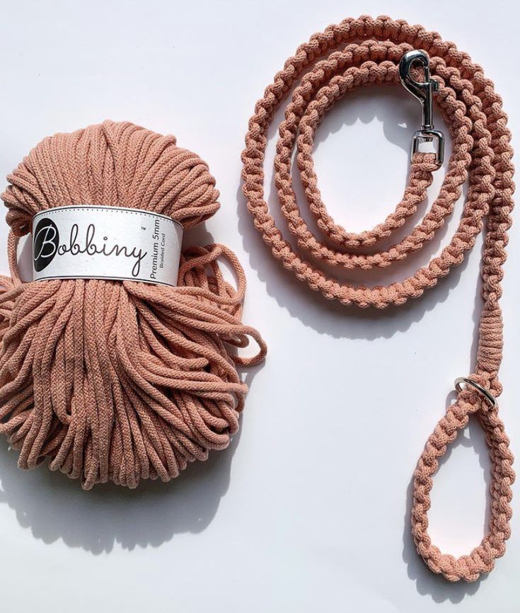 a ball of yarn with a lanyard on the end and a rope attached to it