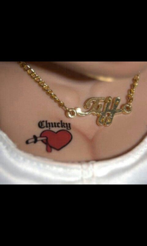 a woman's chest with tattoos on it and the word chicky written in cursive font