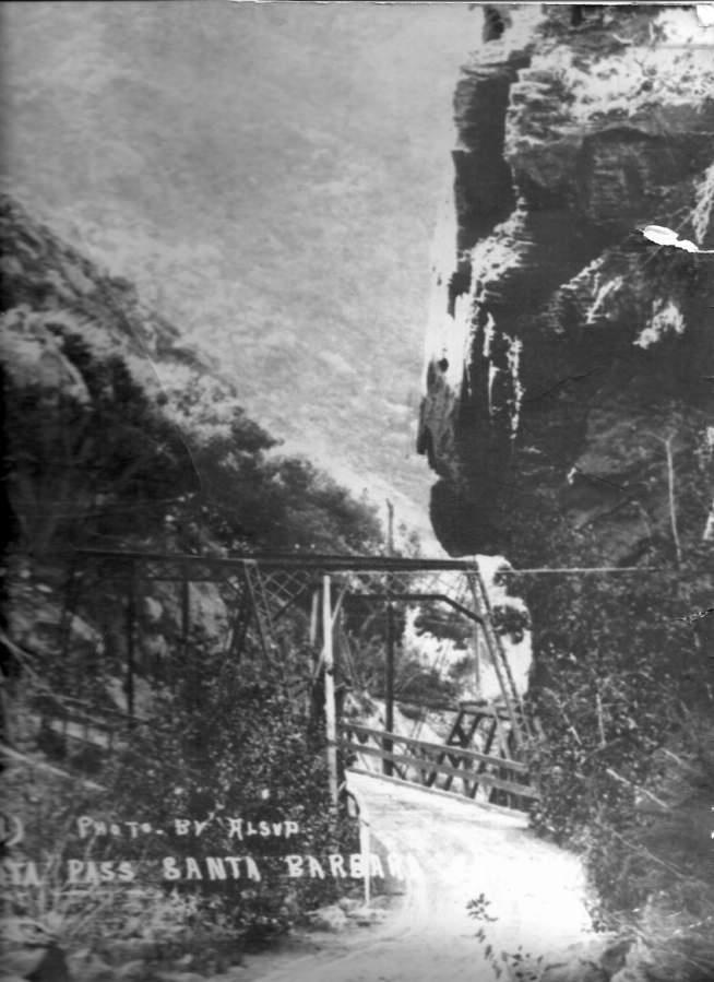 an old black and white photo of a bridge