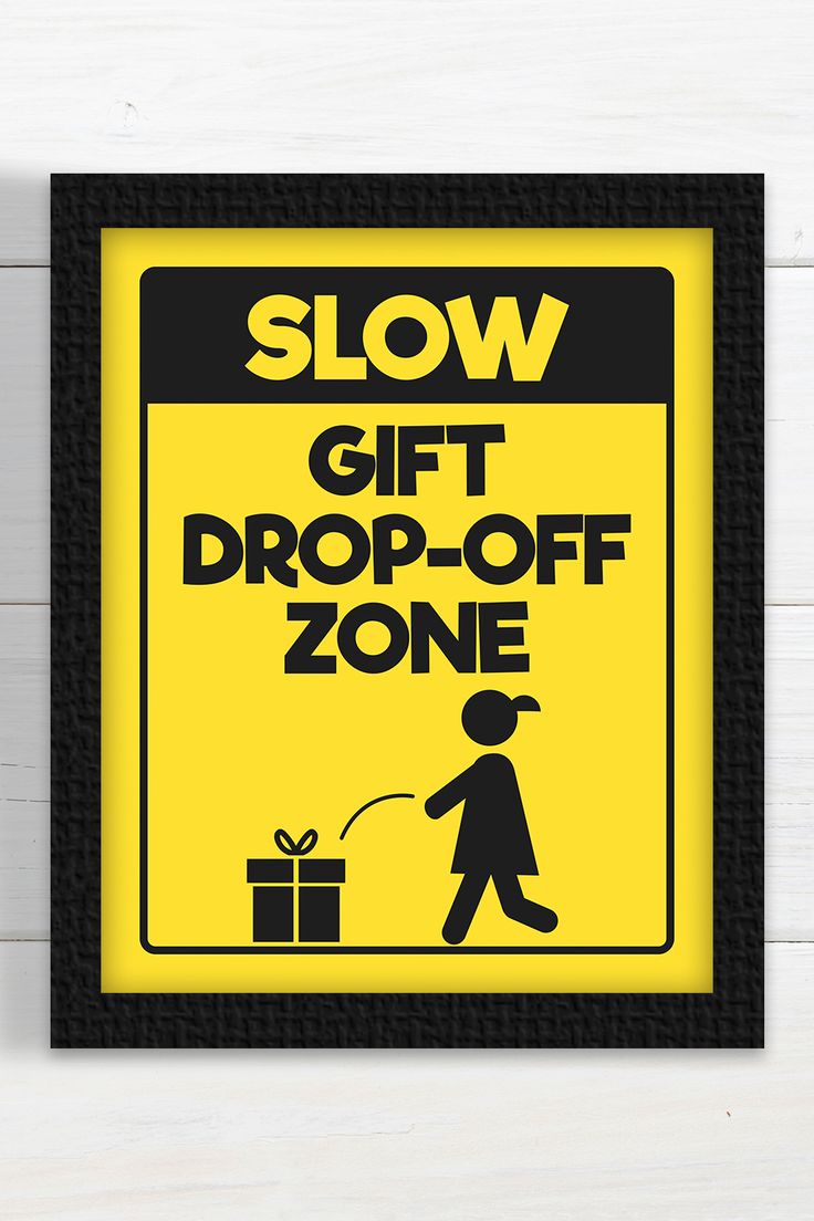 a yellow sign that says slow gift drop off zone