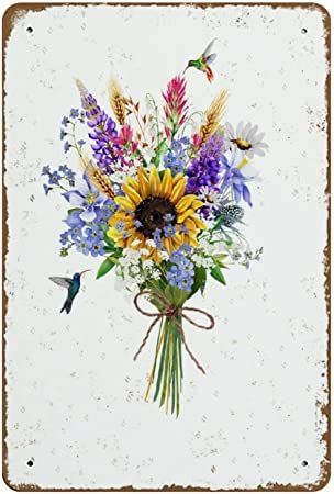 a bouquet of wildflowers and other flowers on a white background with an old rusty frame