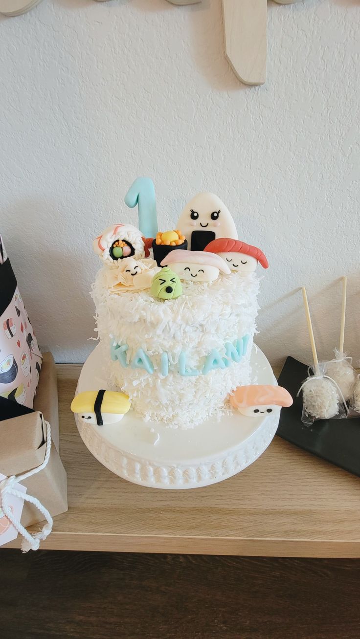 a white cake sitting on top of a wooden table