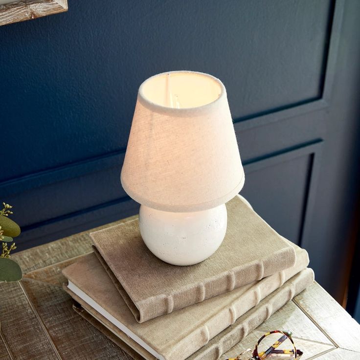 Our versatile Landry Mini Lamp features a timeless globe shape and textural off white finish for a classic look. Topped with a European fitted shade, this tiny table lamp will complement any decor. A charming accent lamp for the kitchen counter, bathroom vanity or open shelving vignette. Mini Lamp measures: 5.25 x 5.25 x 8.5 tallMax wattage: 25WSocket: E12Comes with European fitted shade. Small Kitchen Counter Lamps, Mini Lamp Decor, Mini Lamp For Kitchen Counter, Kitchen Counter Lamps, Lamp For Kitchen Counter, Kitchen Lamps On Counter, Small Kitchen Counter, Tiny Table, Counter Bathroom