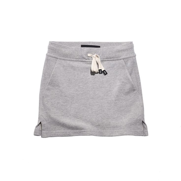 This casual sporty short skirt is perfect for summer. Made of 100% cotton mid-weight french terry. Features Angled front pockets are lined with rib for breathability and bulk reduction Small side slits 5-thread serged and topstitched side seams - for durability and longevity. 3/8" drawcord available in natural cotton or black cotton Heavy woven 2" elastic floating waistband Designed, cut and sewn in our factory in Oshawa Ontario. Model Info Ruby is wearing Size Small Short Skirt in Black with a Oshawa Ontario, Sport Skirt, Cute Sporty Outfits, Short Pollera, Pilates Gym, Japan Outfit, British Racing Green, Sporty Shorts, Jersey Skirt