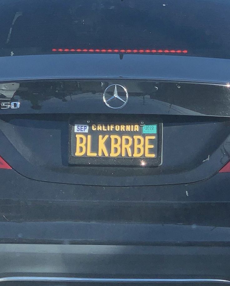 the back end of a black car with a license plate that reads, california blkrbbe