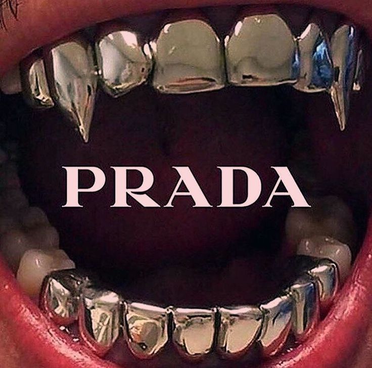 a close up of a person's mouth with braces on it and the words prada in front of them