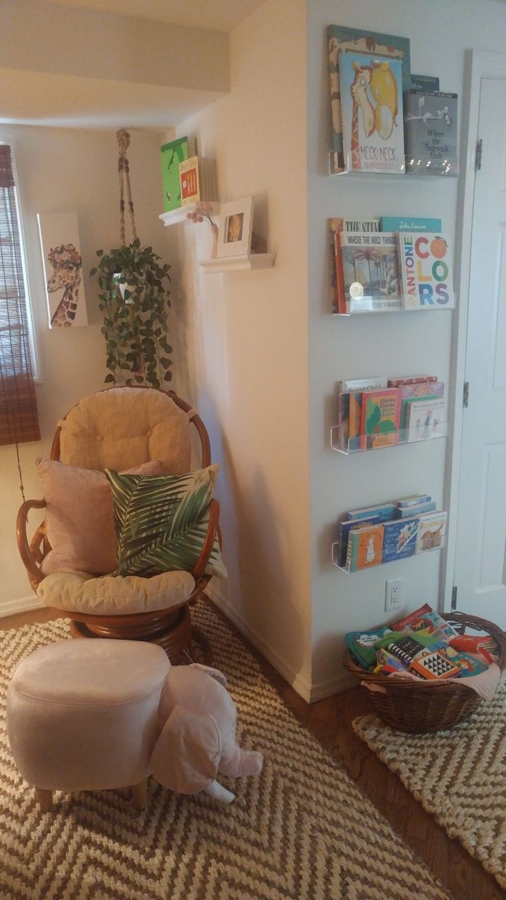 a chair and ottoman in a small room