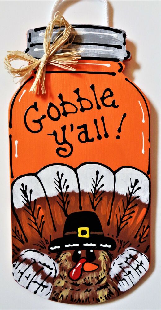 a wooden sign that says gobble y'all with a turkey wearing a hat