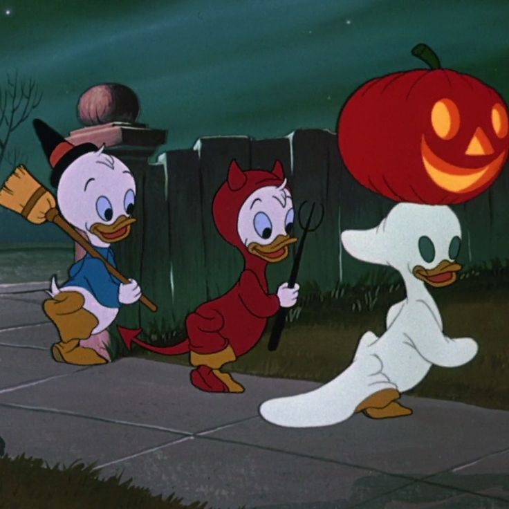 three cartoon characters dressed in halloween costumes, one with a pumpkin on his head and the other holding a broom