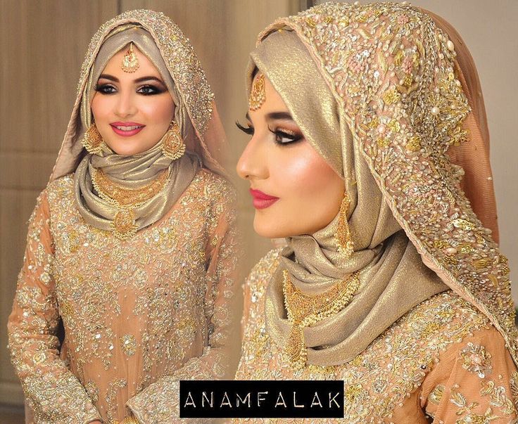 two beautiful women dressed in gold and wearing headscarves, hijabs and veils