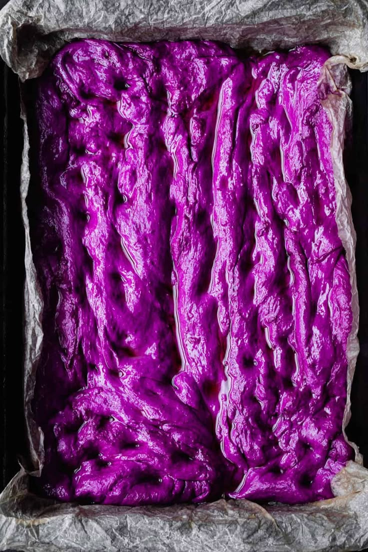 purple colored food is in a metal container