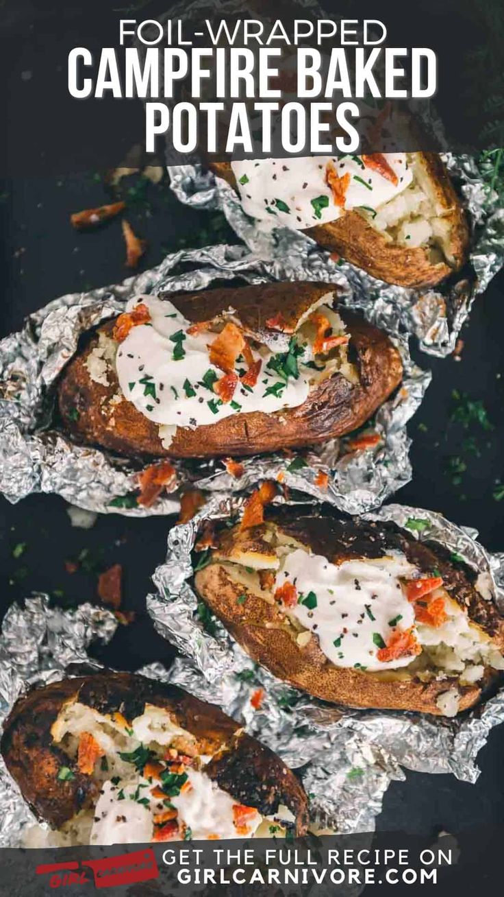 baked potatoes covered in cheese and herbs on tin foil, ready to be served for dinner