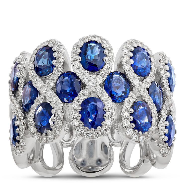 This stunner of a gemstone ring features 14 sapphires surrounded by figure-eight halos of sparkling round diamonds.  The 14k white gold setting is the perfect pairing of precious metal and gemstones because it elegantly complements the deep blue color of the sapphires and light-catching glow of round-cut diamonds. This is truly an heirloom quality piece made to wear and love for a lifetime Harry Winston Sapphire, Blue Diamond Jewelry, Deep Blue Color, Sapphire And Diamond Ring, Harry Winston, Ring Size Guide, Blue Diamond, Precious Metal, All That Glitters