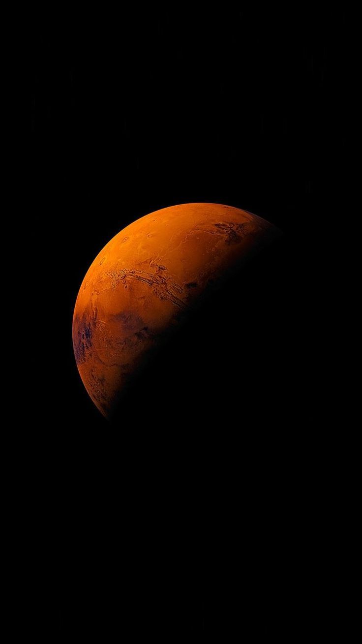 an orange moon in the dark sky with no clouds on it's side, as seen from earth