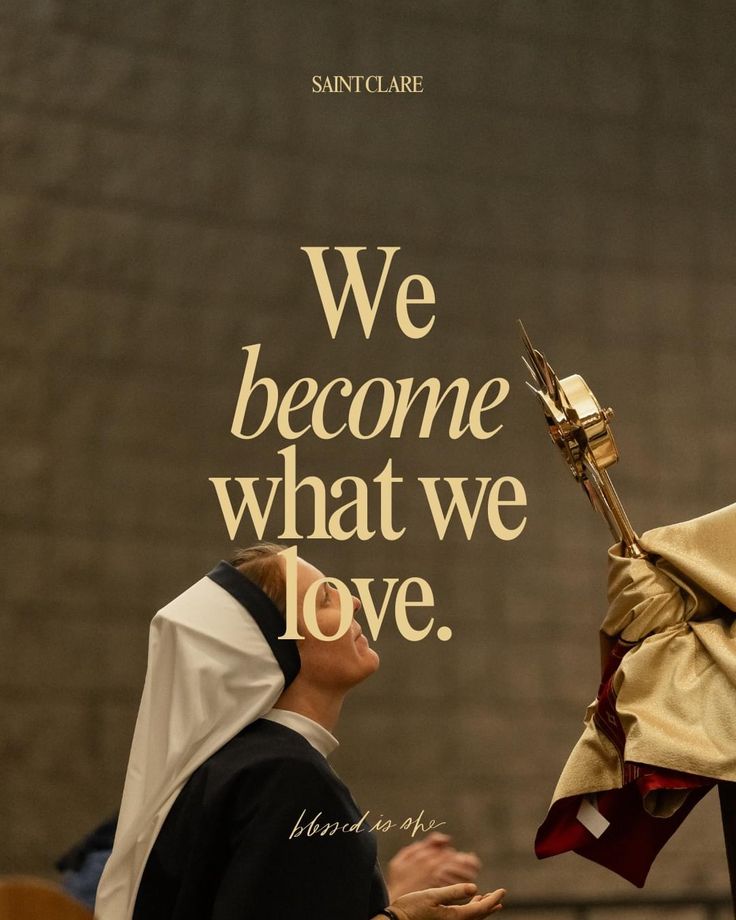 a woman in a priest's robes is looking at a poster with the words we become what we love