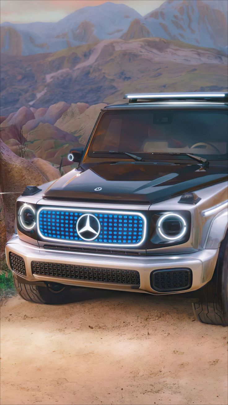 the mercedes benz truck is parked in front of a mountain scene with mountains and hills