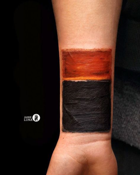 a person's arm with a black and orange color scheme on the left wrist