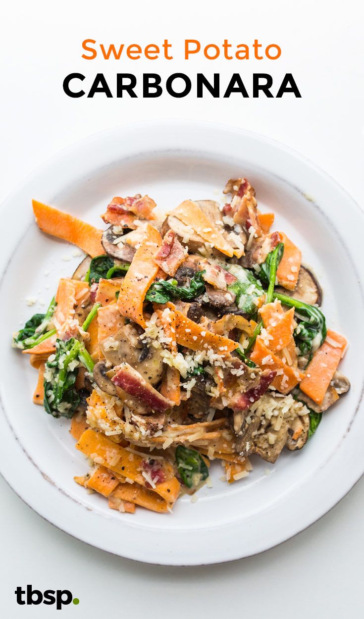 sweet potato carbonara with spinach and mushrooms on a white plate text reads, sweet potato carbonara