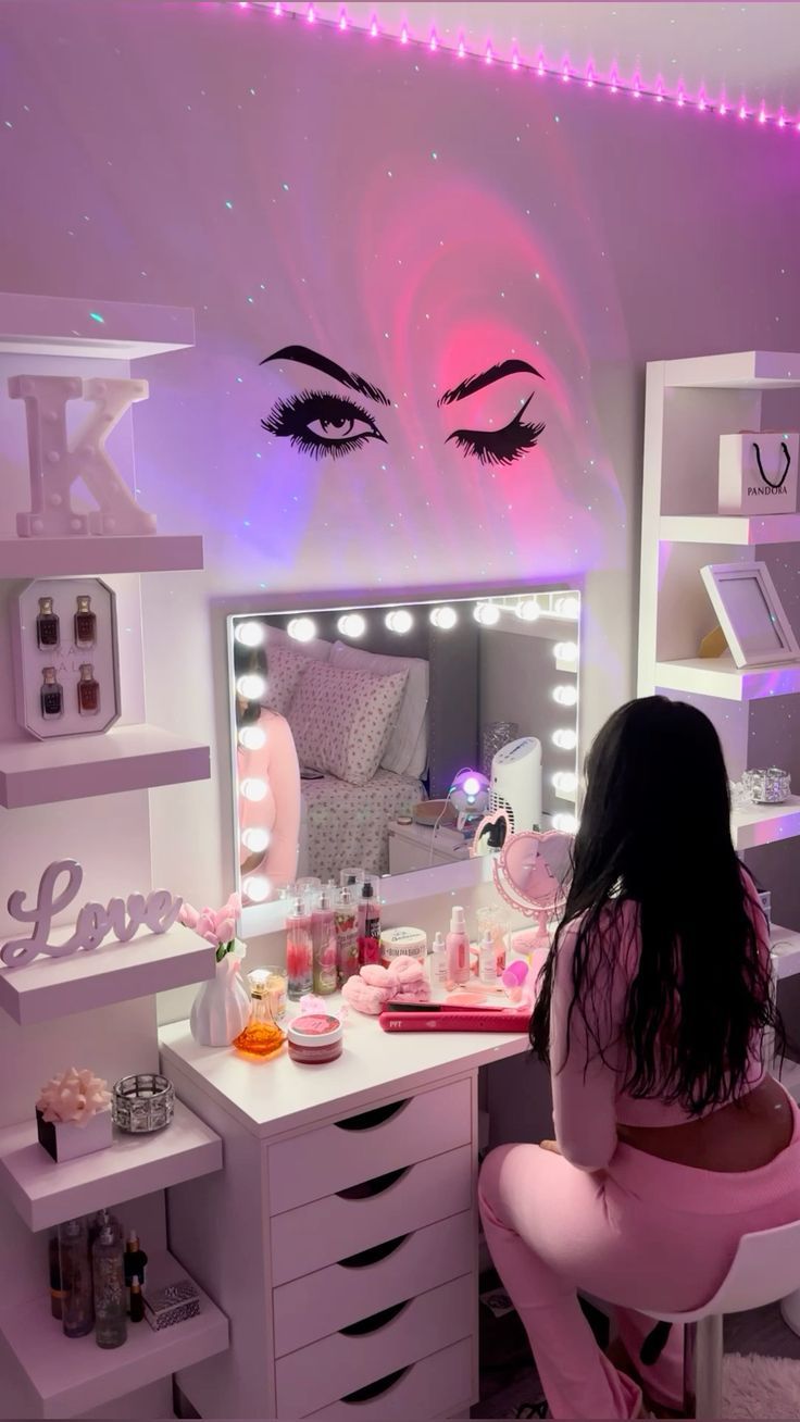 a woman sitting at a vanity in front of a mirror with her eyes open and lights on