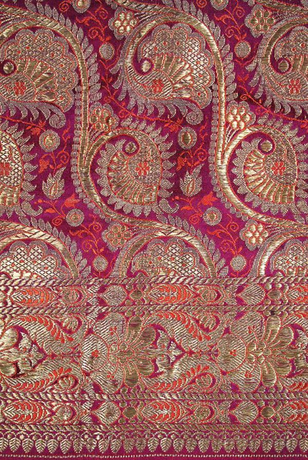 an intricately designed red and gold cloth with paisley designs on it's edges