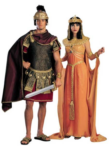 two people dressed in roman costumes standing next to each other