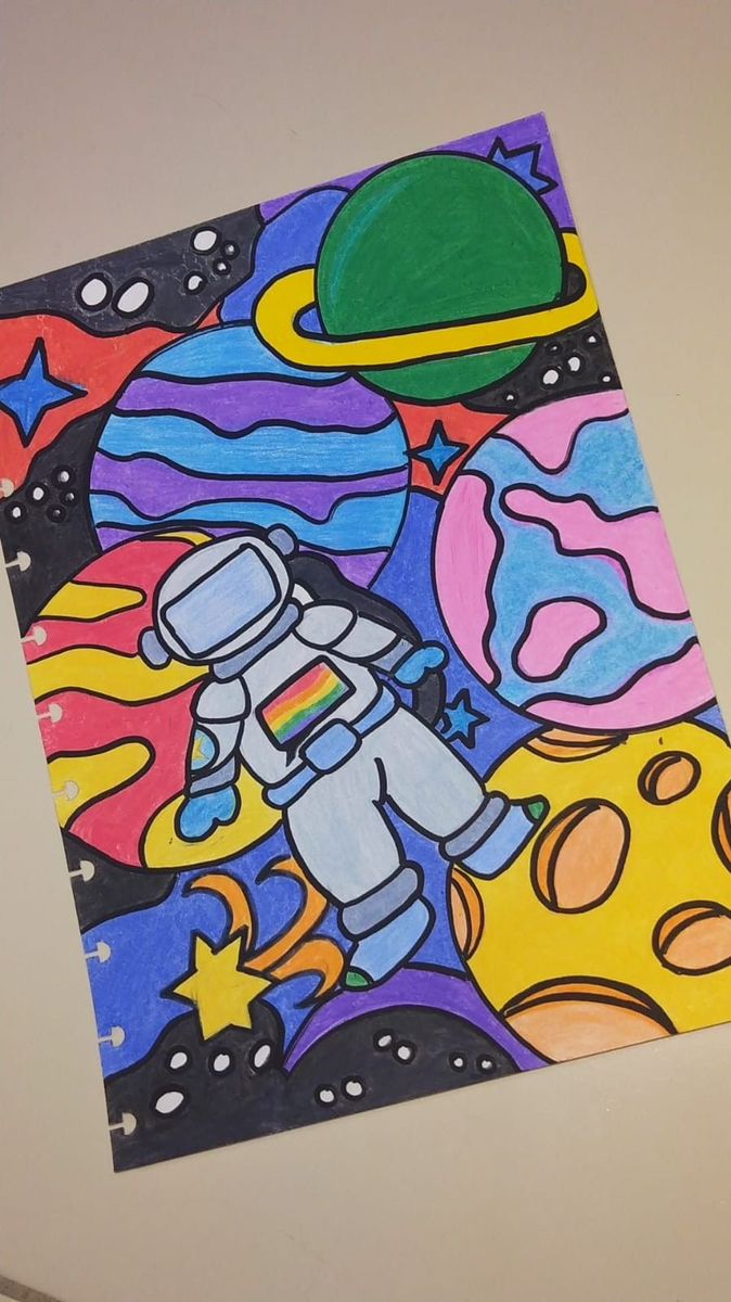 a drawing of an astronaut in outer space with stars and planets around him on a piece of paper