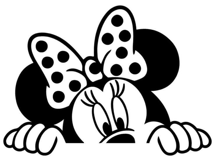 mickey mouse with polka dots on his head peeking out from behind a sign that says,