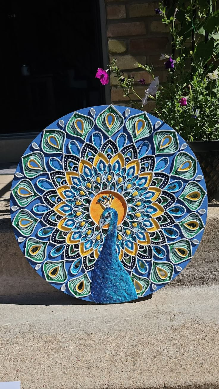 a peacock painted on the side of a building