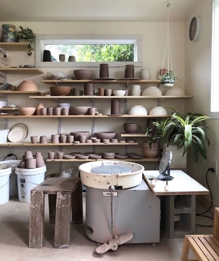 a room filled with lots of different types of pottery