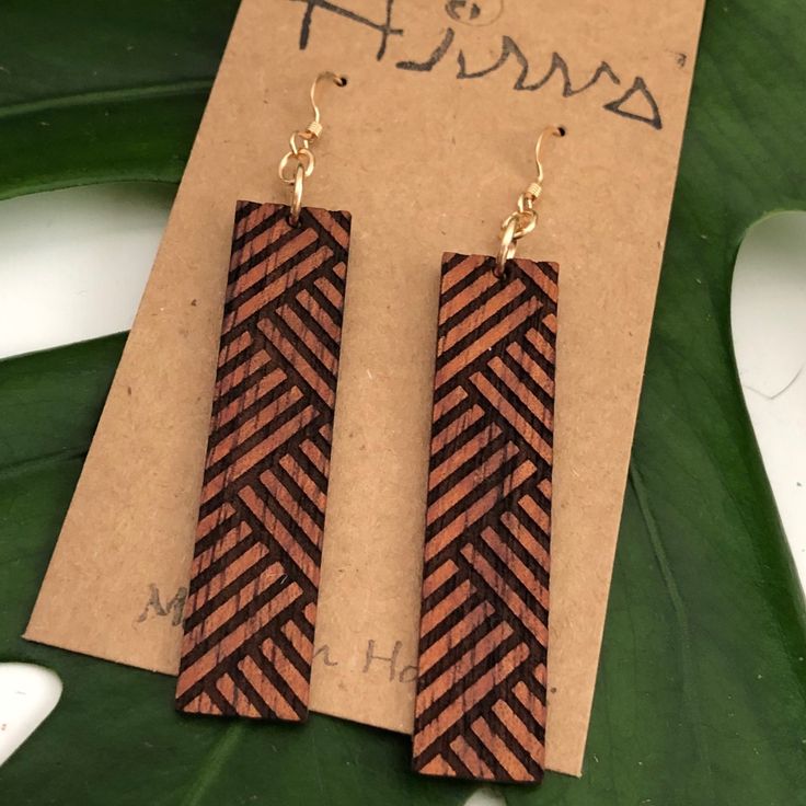 Lauhala pattern design earring made with Hawaiian Koa Wood. These earrings are laser cut and handmade on O'ahu. Hawaiian Koa Earring is lightweight and easy to wear. The length is 7cm and the width is 1.1cm. The length is measured from the top of the hook. It is finished with 14k Gold filled or Sterling Silver Coil only Earring Hooks. Please note the color you want. We repurpose the left over, discarded, or scrap koa from various woodshops and builders and use it to create our pieces. Koa is kno Laser Cut Bracelet, Wooden Earrings Handmade, Sterling Silver Earrings Handmade, Wood Earring, Laser Cut Jewelry, Laser Cut Earrings, Picture Engraving, Cut Earrings, Koa Wood