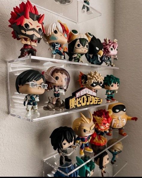 some anime figurines are hanging on the wall