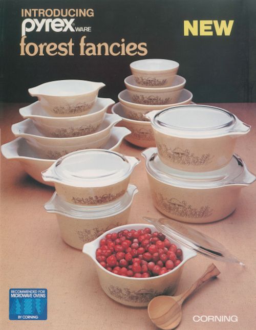 an advertisement for pyrex ware featuring white dishes and red berries