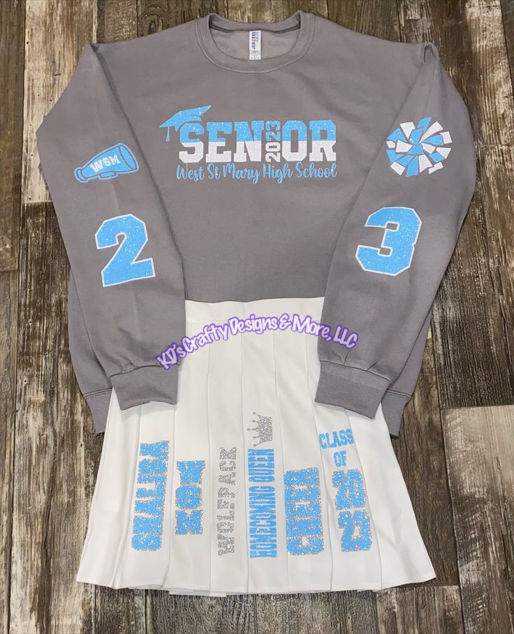 Custom Skirt Sets can be customized to match your school Sets can be made for: * High School Graduate * 8th grade graduate  * Kindergarten graduate  * Pre-K graduate * Head Start graduate  * Birthdays  Message with details: 1. Sweatshirt size  2. Sweatshirt color  3. Skirt size 4. Skirt color (white, black, blue, red, pink) please message with color of skirt because not all colors come in every size. 5. Name 6. School name or mascot (note if you want the school name or mascot on the skirt) 7. Graduation year 8. School colors (colors will be designed to my liking unless specified by customer) Message me with any questions or concerns.  Etsy shows an estimated delivery time. If you need your set by a specific date message me before ordering as a rush fee will be applied No returns/refunds wi Senior Graduation Skirt Set, Senior Skirt Painted, Graduation Custom Shirts, Senior Shirt And Skirt, 8th Grade Outfits For School, Senior Skirt Set, Graduation Skirt, Senior Skirt, High School Graduation Outfit