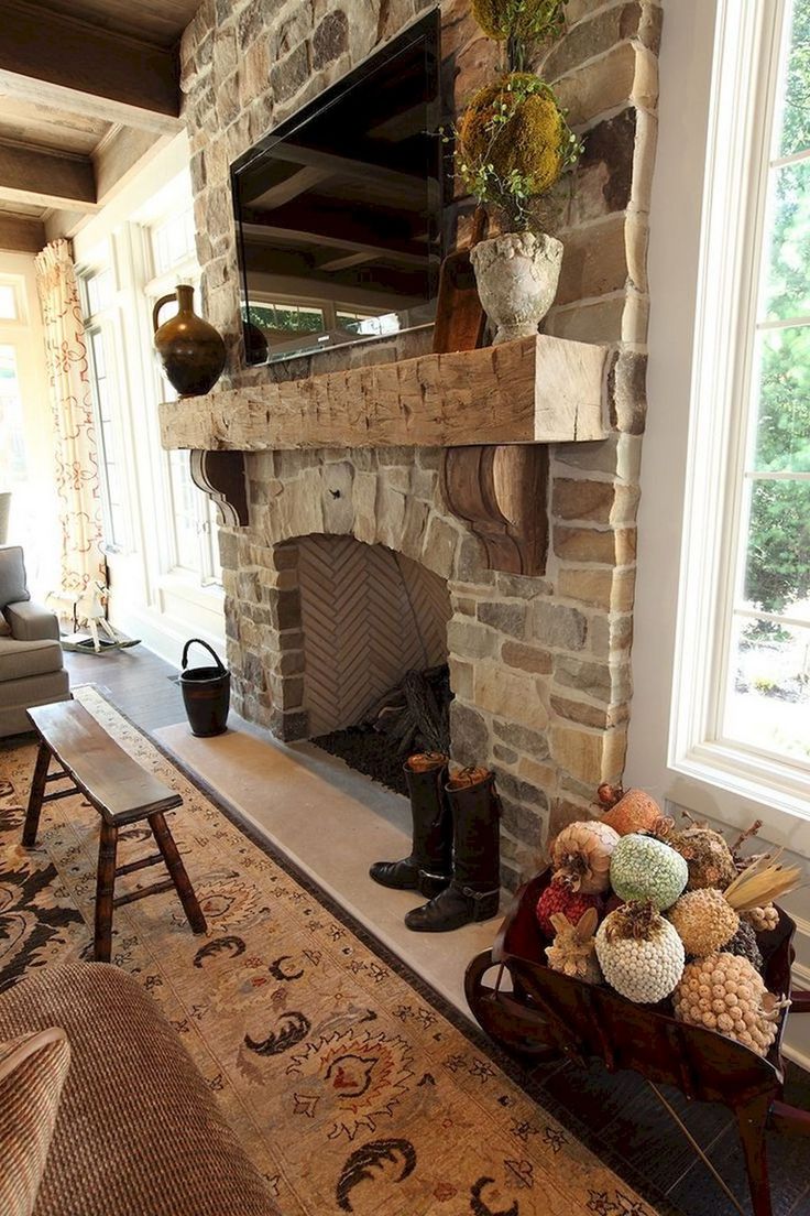 a living room filled with furniture and a fire place