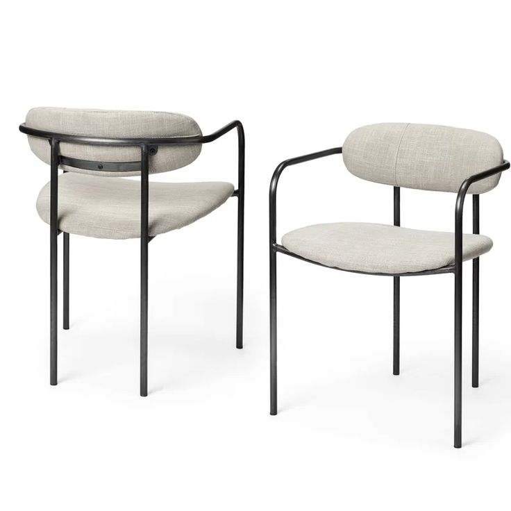 two chairs, one with a black frame and the other beige fabric upholstered