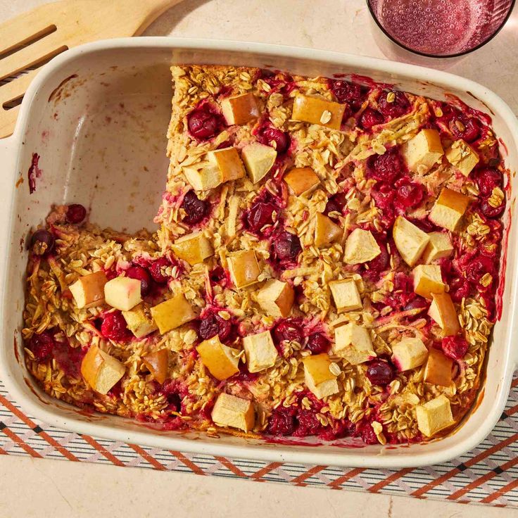 a casserole dish with fruit and oatmeal in it