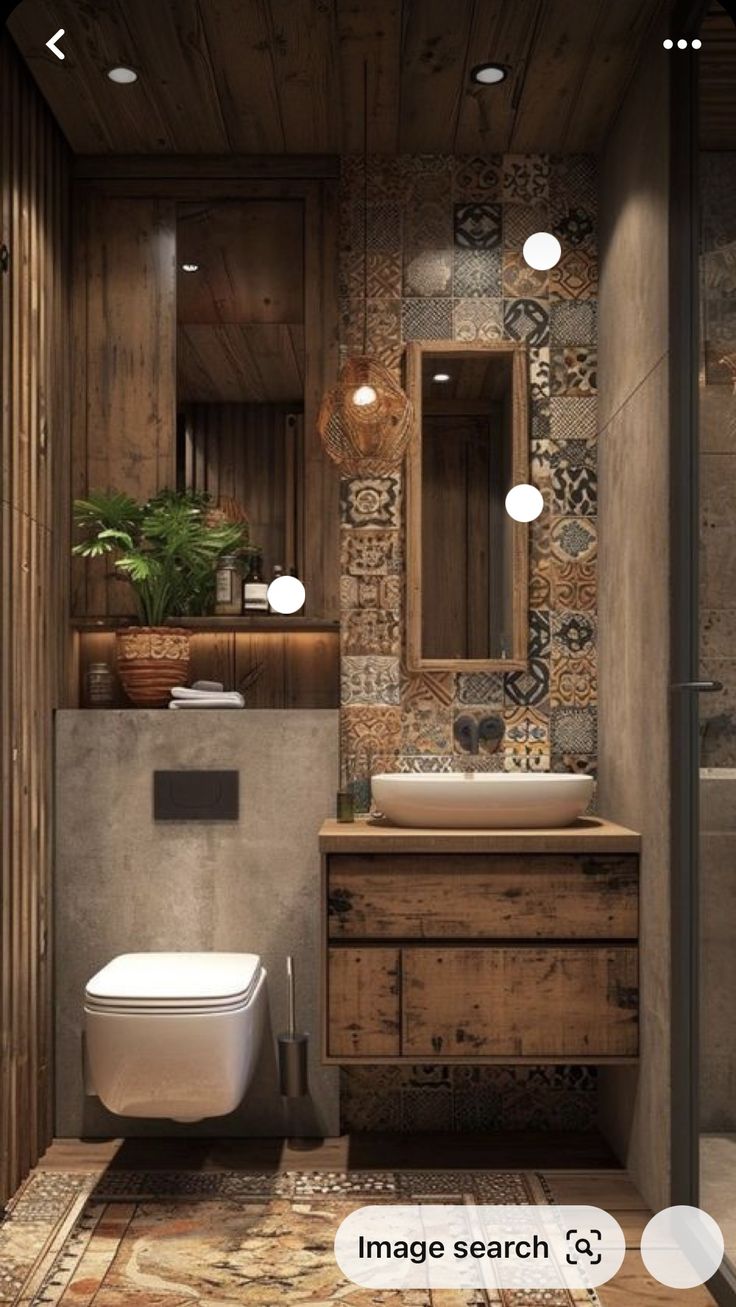 a bathroom with a toilet, sink and mirror next to a plant in a pot