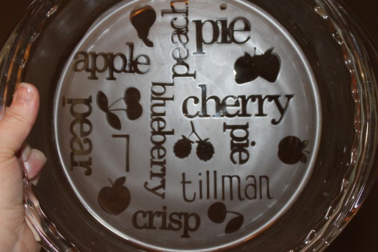 a person holding up an apple pie with the words apple pie and cherry written on it